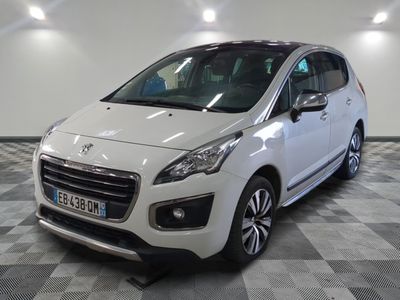a picture of a small white car parked in a garage