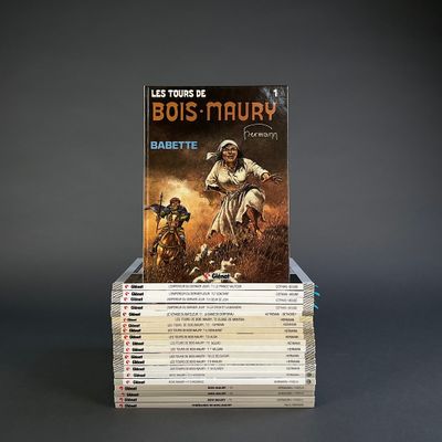 books stacked on top of each other on a gray surface