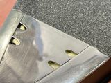 a close up of a piece of metal on a table