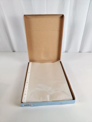 an open box with a piece of paper in it sitting on a white surface