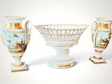 three vases sitting next to each other on a white surface
