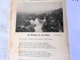 an old book with a picture of a river in it