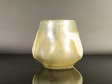 a glass vase that is sitting on a table
