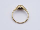 a close up of a gold ring with a stone in the middle