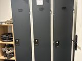 three lockers in a room with shoes on the floor