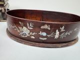 a large wooden bowl with a floral design on it