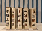 five books that are lined up on a table