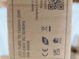 a person holding a brown box with a qr code on it