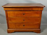 an image of a wooden chest of drawers
