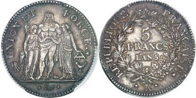 a silver coin with a picture of a woman and a man on it