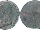 a close up of a coin with a woman on it