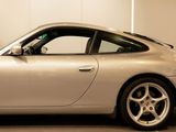 a silver car that is parked in a garage