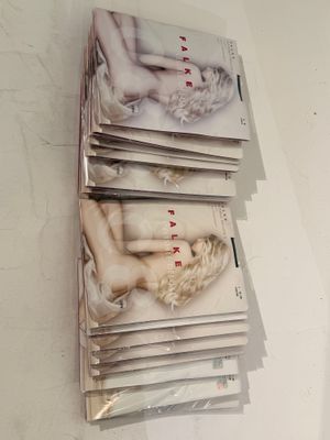 a stack of magazines on the wall of a room