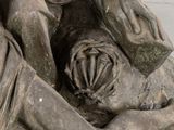 a statue of a woman holding a baby in her arms
