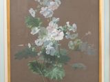 tableau représentant des fleurs blanches dans un cadre bleu sur fond marron