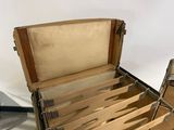 a wooden box with knives in it on a table