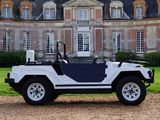 a white jeep parked in front of a large building