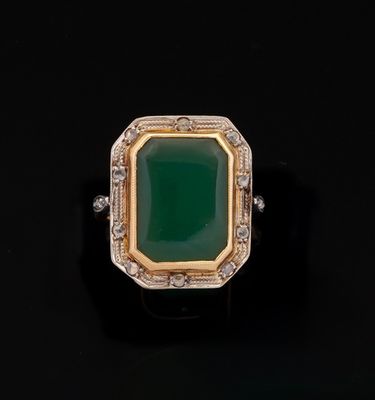 an emerald and diamond ring
