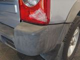 a close up of a car ' s tail light on the back of a truck