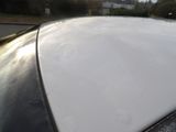 a close up of a car ' s roof with snow on it