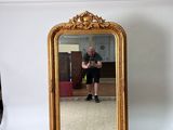 a man taking a picture of himself in a mirror