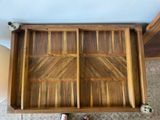 a wooden drawer that has two drawers inside of it
