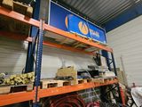 a large rack with various tools on it in a warehouse