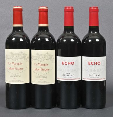 three bottles of red wine sitting next to each other on a table