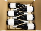 six bottles of wine in a box on the table