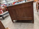 an old wooden chest in the middle of a room