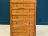 an old wooden chest of drawers with marble top