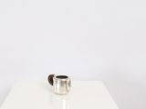 a silver coffee pot sitting on a white table