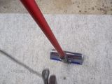 a person standing on the floor with a vacuum mop on the floor