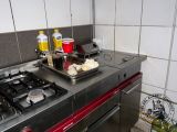 a kitchen with a stove top and a dish on the stove