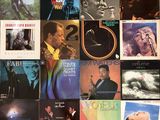 a lot of records on the wall of a room