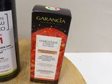 a bottle of wine and a box of soap on a table
