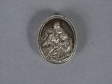 a close up of a silver coin with a person on it