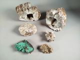 several different types of rocks and stones on a white surface