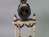 a clock that is sitting on top of a table