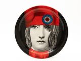 a plate with a picture of a man wearing a red hat