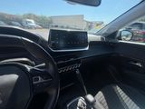 the interior of a car with a steering wheel and dashboard