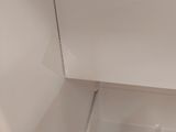 a white refrigerator with a glass door in a room