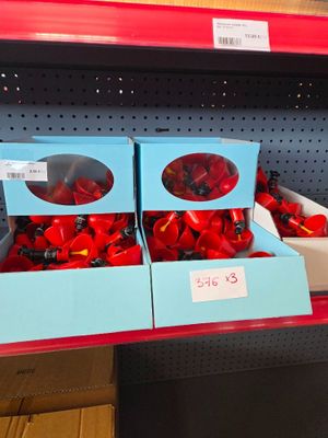 two boxes of red peppers on the shelf in the store