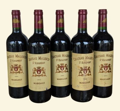 six bottles of red wine are lined up in a row
