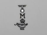 an image of a close up of a plate with a crown on it