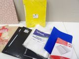 many different types of folders on the table