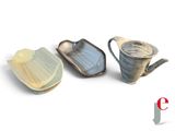 three different types of dishes on a white surface