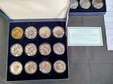 a lot of coins in a box on a table