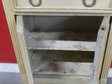 a small table with a drawer on top of it