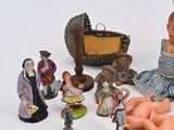many figurines that are sitting on a white surface